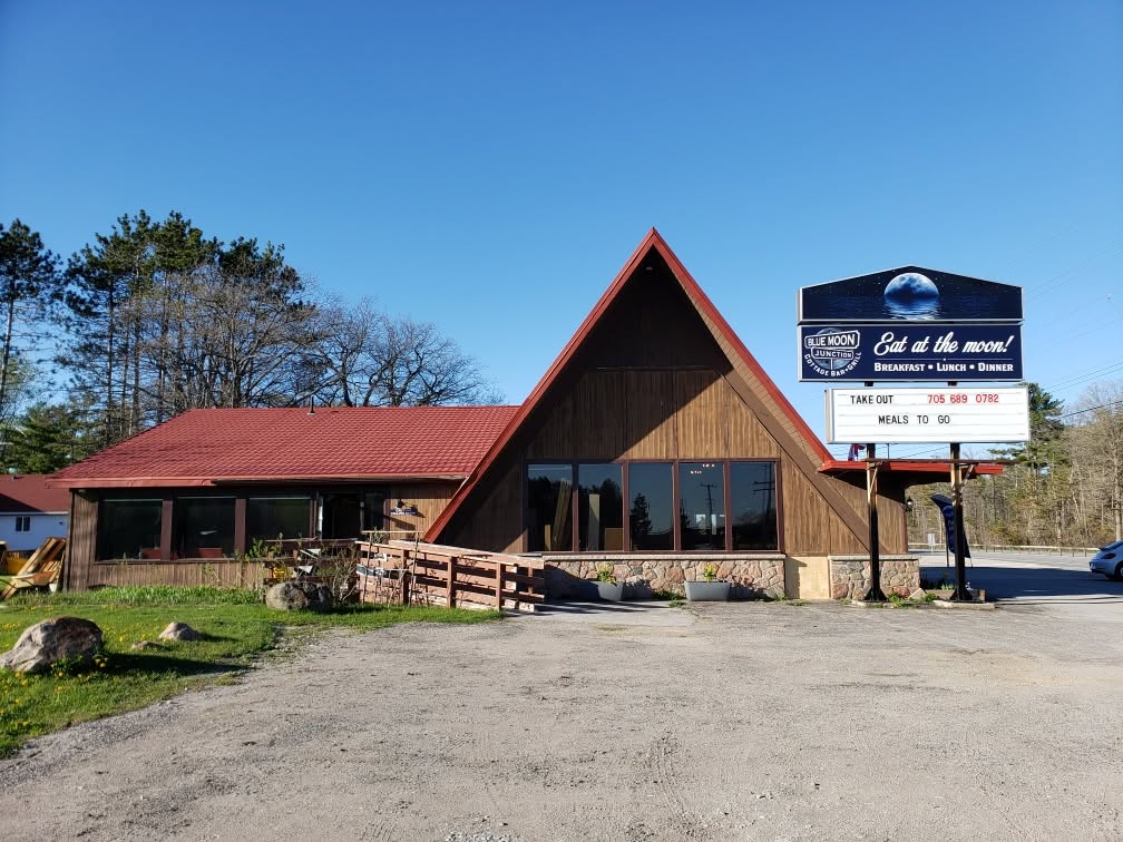 Blue Moon Junction Cottage Bar & Grill's A-frame building and roadside sign on Highway 11 South in Washago